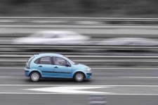 view-passenger-car-on-the-highway-in-motion-with-a-blurred-background-photo.jpg